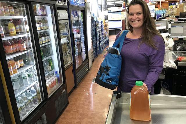 A supermarket shopper in Long Beach with a reusable bag.